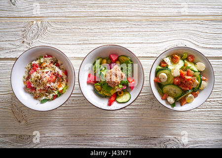 3 salad mix bowls healthy food on white wood table Stock Photo