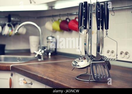 Kitchen utensils on  work top in modern kitchen Stock Photo