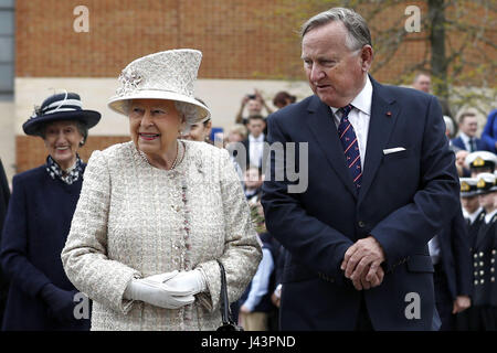 Queen Elizabeth II is accompanied by Chair of Governors, Roger Laneknott during a visit to Pangbourne College in Berkshire to celebrate its centenary. Stock Photo