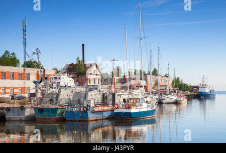 Sailing ships moored in Lomonosovskaya gavan of Baltic Sea. Saint-Petersburg region, Russia Stock Photo