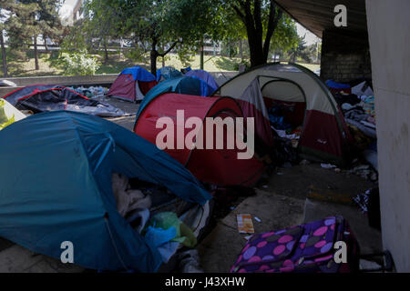 Paris, France. 9th May 2017. The tents that are located under an overpass leading to ring road around Paris are abandoned after the eviction. City officials of Paris are cleaning the abandoned tents of the refugee camp that has spread around the reception centre. The camp was evicted earlier in the morning. Credit: Michael Debets/Alamy Live News Stock Photo