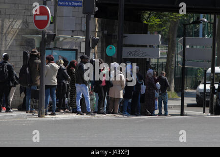 Paris, France. 9th May, 2017. Refugees are still around in the area, waiting for an opportunity to resettle around the official camp. City officials of Paris are cleaning the abandoned tents of the refugee camp that has spread around the reception centre. The camp was evicted earlier in the morning. Photo: Cronos/Michael Debets/Alamy Live News Stock Photo