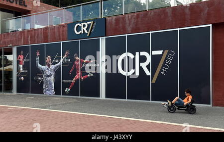 Funchal, Madeira, Portugal. 9th May, 2017. A boy is seen outside the new CR7 Museum in Funchal, capital of Madeira Island in Portugal, on May 8, 2017. The new museum opened to the public on July 1, 2016. The two-storey private museum of Portuguese football star Cristiano Ronaldo, which is next to the Pestana CR7 Hotel, covers an area of 1,400 square meters and displays over 200 items. Credit: Xinhua/Alamy Live News Stock Photo