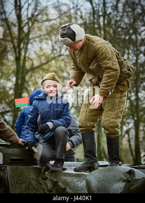 Vitebsk, Belarus. 9th May, 2017. The procession along the main street of the city. Participate in as the veterans of the great Patriotic war and young generation of Vitebsk. People give flowers to the elderly and lay wreaths at the monument 'Eternal Fire'. Credit: Alexey Vronsky/Alamy Live News Stock Photo