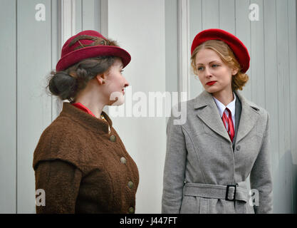 St. Petersburg, Russia. 9th May, 2017. Two models are dressed in spring dresses of 1940 at a retro show in the Summer Garden in St. Petersburg at the celebration of the Victory Day. Credit: Olga Prolygina/Alamy Live News Stock Photo