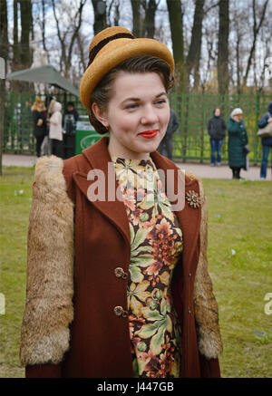St. Petersburg, Russia. 9th May, 2017. The model is dressed in spring dresses of 1940 at a retro show in the Summer Garden in St. Petersburg at the celebration of the Victory Day. Stock Photo