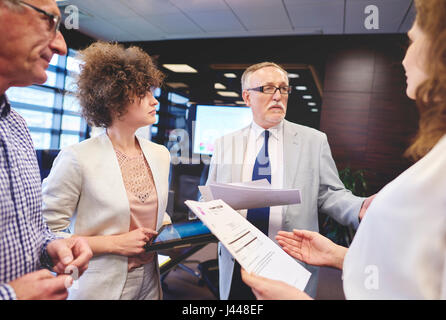 Business people making controversial decision Stock Photo