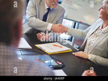 Business man shaking hands with business woman Stock Photo
