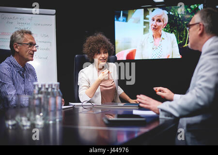 Business people having tele conference Stock Photo