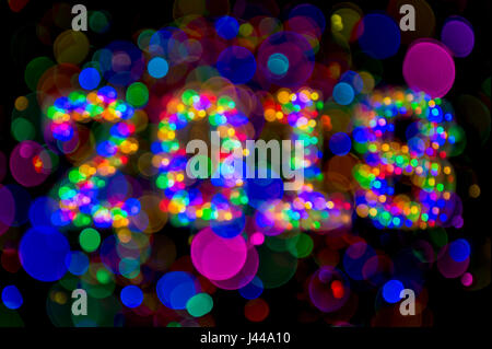 Abstract 2018 message made from defocus colorful bokeh lights on dark background Stock Photo