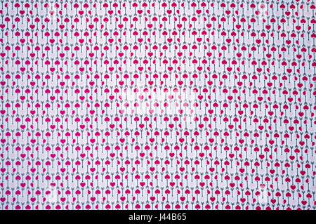 Red and Pink Love Hearts Repetitive Pattern with Cupid Arrows On a White Background Stock Photo