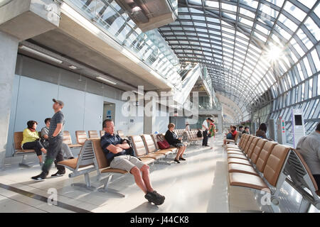 SAMUT PRAKAN, THAILAND - JANUARY 19, 2017: Travelers, passengers waiting flight in the terminal of Suvarnabhumi Airport Stock Photo