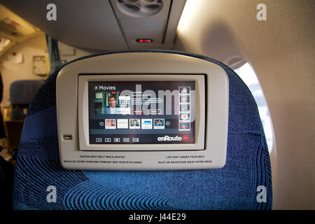 TORONTO, CANADA - JAN 28th, 2017: Air Canada Business class seats inside an Embraer ERJ-190 from AC. Air Canadas Embraer ERJ-190 business class on this configuration consists of a total of 9 seats, 1-2 layout in Executive class, personal entertainment system screen Stock Photo