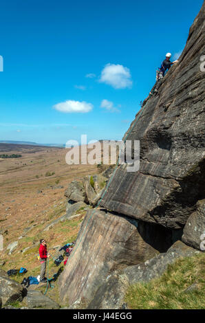 Rock climbers on Stanage Edge, Peak District, Derbyshire Stock Photo