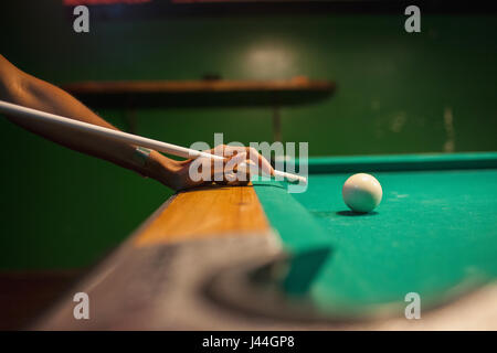 A young man playing pool. Stock Photo