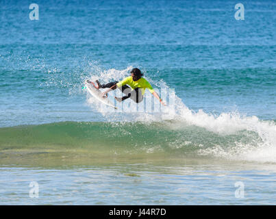 Young male competing in the Werri Slash Surf Competition, Gerringong, New South Wales, NSW, Australia Stock Photo