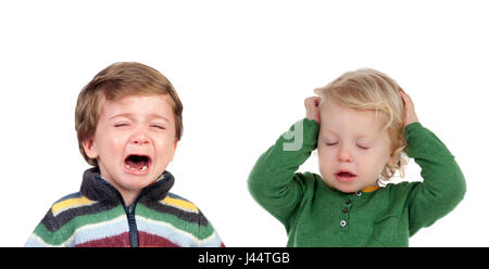 Little child crying and another covering his ears tired of hearing the crying isolated on white background Stock Photo