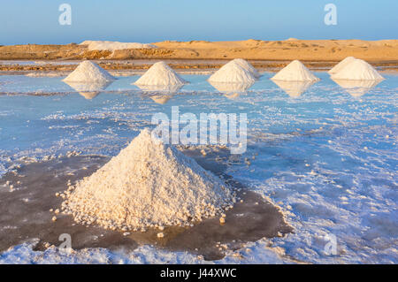 CAPE VERDE SAL Piles of salt collected from natural salt pans at Salinas, just outside Santa Maria, Sal island, Cape Verde, Africa Stock Photo