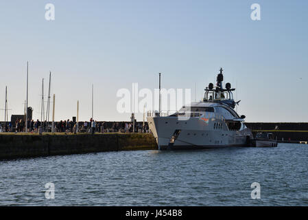 The beautiful Russian superyacht Lady M owned by Russian billionaire alexei Mordashov docked at historic Whitehaven harbour and marina Stock Photo