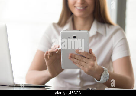 Close up image of digital tablet in womans hands Stock Photo