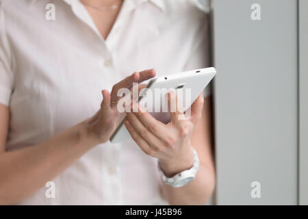 Close up photo of digital tablet in womans hands Stock Photo