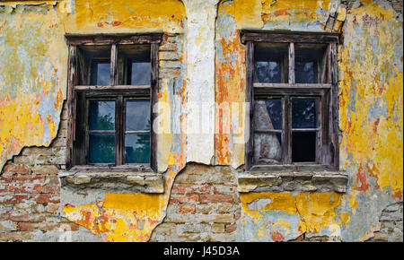 Old window on a farmhouse in Serbia who still resists time. Stock Photo