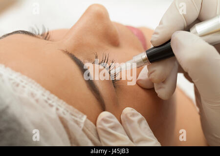 Permanent makeup eyebrow with eyebrows holder Stock Photo