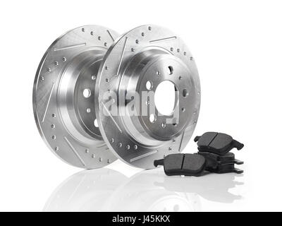 Car brake discs, rotors and break pads isolated on white background. Automotive parts still life. Stock Photo