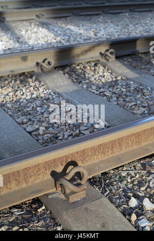 Pandrol clips, part of the railway fastening system on the Calgary C Train tracks Stock Photo