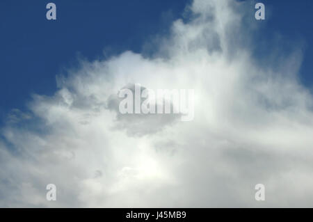 Air and sky is thin and whispy on this clear and sunny day.  Clouds fill two thirds of image. Stock Photo