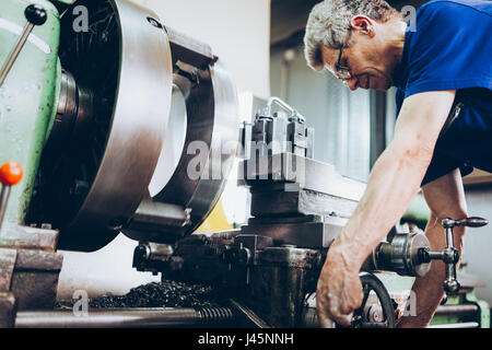 industrial factory worker working in metal manufacturing industry Stock Photo