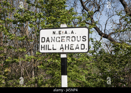 A road sign waning of' Dangerous Hill Ahead' at Beamish Museum,England,UK Stock Photo