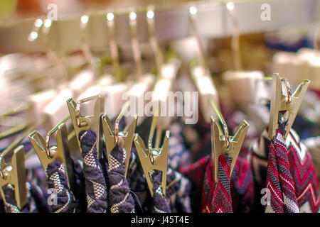 Image clothespins keep things on a hanger in the store Stock Photo