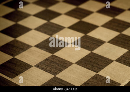 black and white wooden chessboard closeup Stock Photo