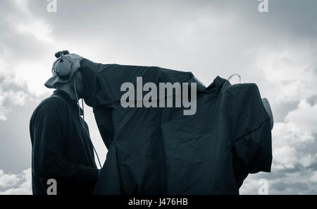 TV Cameraman at outdoor event Stock Photo