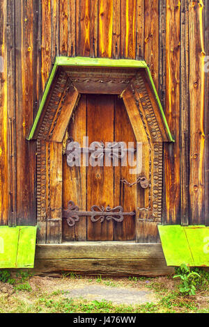 a antique wooden doors on forged curtains locked Stock Photo