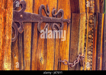 a antique wooden doors on forged curtains locke Stock Photo