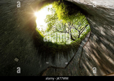 Spiral staircase of underground crossing in tunnel at Fort Canning Park, Singapore Stock Photo