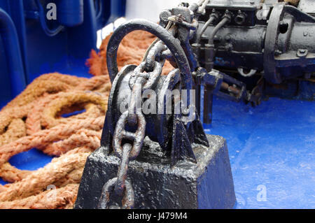 Black painted anchor winch on ship Stock Photo