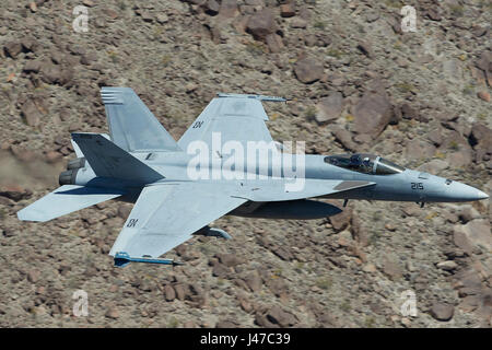 United States Navy F/A-18E, Super Hornet, Single Seat Jet Fighter, Flying At High Speed And Low Level Through A Desert Canyon. Stock Photo