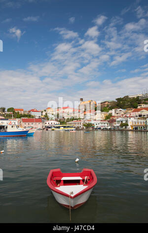 Boats in the Carenage surrounded by colourful buildings on a hill in St. George's, capital of Grenada, West Indies, Caribbean Stock Photo