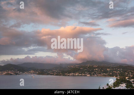 A dramatic pink cloud formation over Grand Anse and St. George’s, capital of Grenada, West Indies, Caribbean Stock Photo