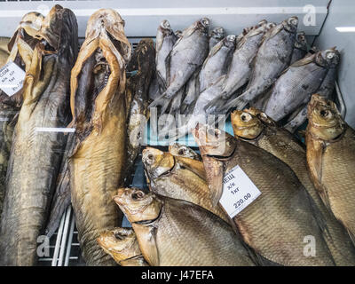 Dried and salted Catfish for sale on a market stall in Kazan, Tatarstan. Traditionally eaten when drinking beer. Stock Photo