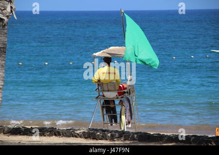 Lifeguard overlooking beach at Playa Las Cucharas, Costa Teguise, Lanzarote, Canary Islands, Spain Stock Photo