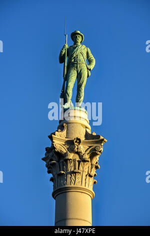Confederate Soldiers' & Sailors' Monument. It depicts a bronze Confederate private standing on top of the pillar, which is composed of 13 granite bloc Stock Photo