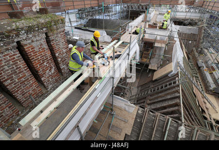 Work is undertaken at The Vyne, a National Trust property in Hampshire, which is undergoing a major restoration to it's roof. Visitors to the property can follow the progress of the £5.4m roof conservation project by viewing it from a new rooftop walkway. Stock Photo