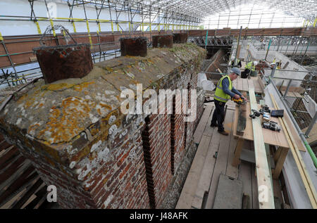 Work is undertaken at The Vyne, a National Trust property in Hampshire, which is undergoing a major restoration to it's roof. Visitors to the property can follow the progress of the £5.4m roof conservation project by viewing it from a new rooftop walkway. Stock Photo