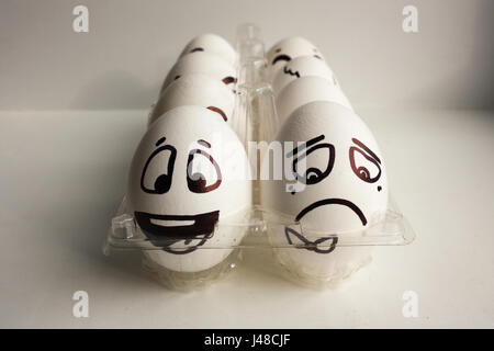 Eggs face. Cheerful company of eggs in two rows. Photo for your design Stock Photo