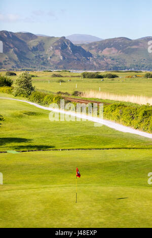 The picturesque and lush fairways of Llandudno Gofl Course located next to the sea and overlooked by mountains located in Conwy County, North Wales Stock Photo