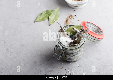 Preparing the salted capelin. Fish preserved for eating Stock Photo